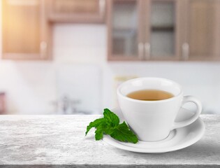 Cup of tasty aroma hot Tea on desk