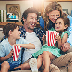 Happy family, relax and laughing with popcorn on sofa for funny movie, weekend or holiday in living...