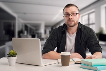 Happy business person typing on computer in office