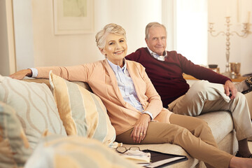 Love, retirement and portrait with senior couple on sofa in living room of home together for bonding. Happy, smile or trust with elderly man and woman in apartment for commitment, marriage or weekend