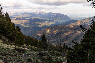 Obraz premium Begunjščica panorama of mountain trekking to the highest peak. View of the Alps, climbing with via ferrata. Distant view of Lake Bled from above. Sports holidays, life of adventure in the countryside