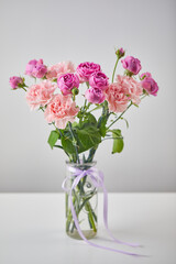 Bouquet of lilac roses and pink carnations