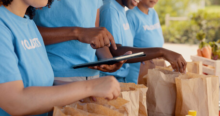 Volunteering, group of people and tablet for food donation, community service and poverty support...