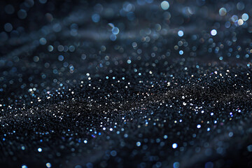 A black background is filled with numerous sparkles, creating a shimmering and dynamic effect