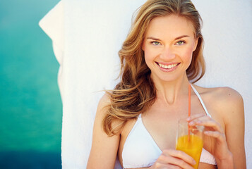 Woman, juice and relax by swimming pool and lounge chair for summer holiday or tropical vacation. Above portrait of person or tourist by hotel with healthy drink, cocktail or alcohol at outdoor break