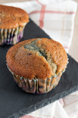 Delicious homemade blueberry muffin rustic background