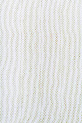 Sweater or scarf fabric texture large knitting. Knitted jersey background with a relief pattern. Wool hand- machine, handmade.