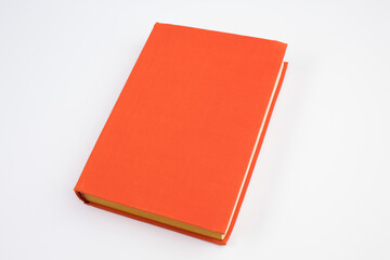 Open bright orange book isolated on white background.