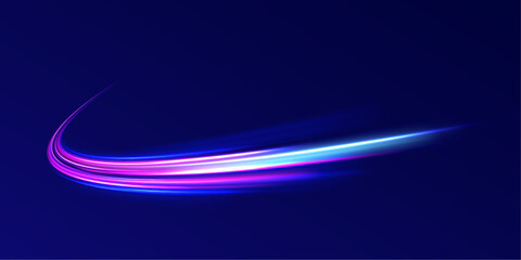 Light motion trails. High speed motion blurred light effects at night in blue and red colors. Glowing spark swirl trail tracing on dark blue background. Abstract light lines of movement and speed. 