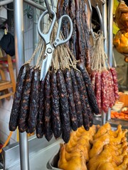 Traditional Chinese dried sausages hang for sale in a fresh market in Taiwan, Taipei. 