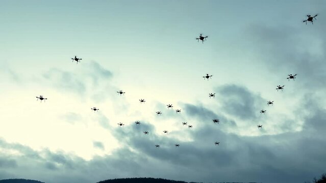 Swarm of Drones Flying in Overcast Sky