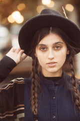 An alluring portrayal of a fashionable woman in a retro hippie ensemble.