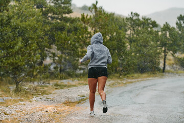 Unstoppable: A Determined Athlete Trains Through the Rain in Pursuit of Marathon Glory