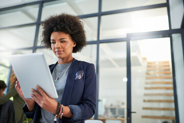 Woman, tech and tablet in office with professional, web design and female person in workspace....