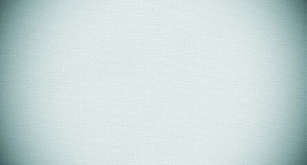 Blue canvas fabric background texture with dark vignette for copy space for design. 