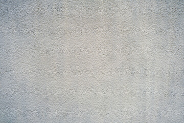 A wall with a gray and white striped pattern