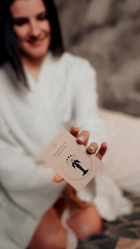 A young woman tells fortunes with cards. A woman wants to know her destiny. The concept of magic and fortune telling. Vertical video