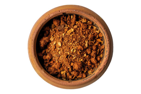 Top view of Rasel hanout spice in a wooden bowl isolated on transparent background