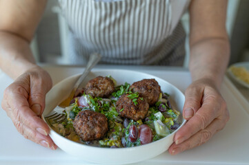 Fresh summer salad with mediterranean meatballs
