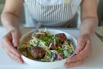 Fresh summer salad with mediterranean meatballs and cheese