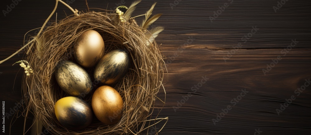 Poster close up image of a dark wooden background with a nest containing golden eggs perfect as an easter b