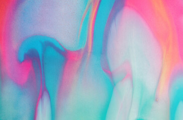 Swirls of vibrant blue, pink, and white merge fluidly, resembling an abstract.