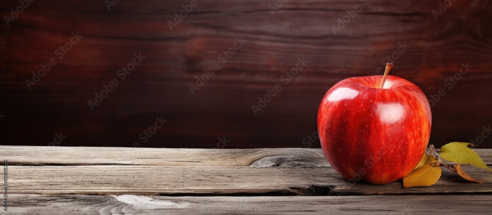 Wall mural the copy space image portrays a fresh apple resting on a rustic wooden table - Wall murals