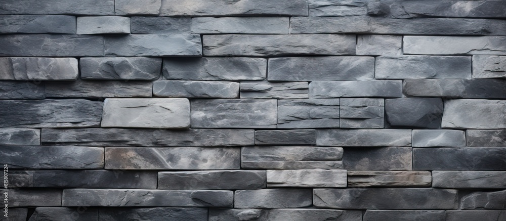 Aufkleber a textured wall made of slate stone providing a background with a copy space image