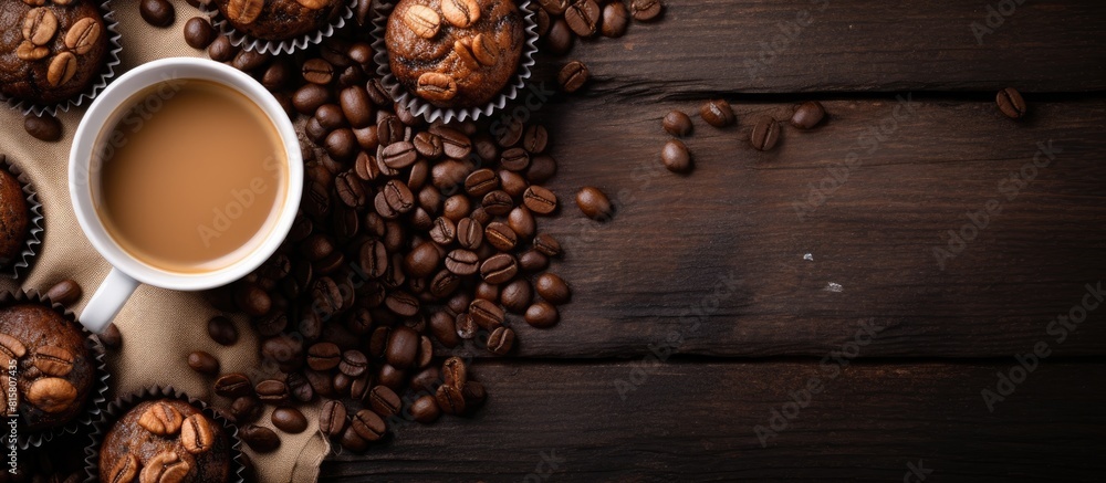 Poster a top down view of chocolate muffins with hazelnuts accompanied by a cup of coffee creates a visuall