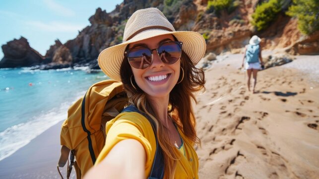 Happy woman backpacker traveler take a selfie photo on amazing ocean coast