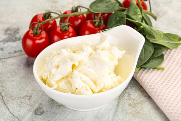 Soft cream cheese in the bowl