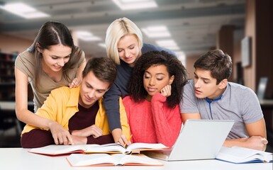 Happy international young students studying together