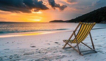 A yellow striped beach chair stands on the white sand beach for summer getaways - Powered by Adobe