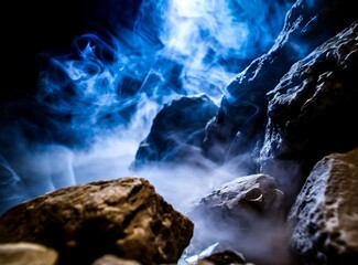 Dark ambient with smoke blue tones and rocks dark illumination