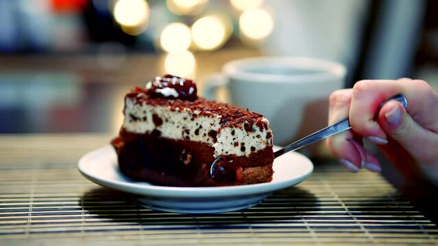 Eating chocolate cake after enjoying mousse pastry dessert at caf&eacute;
