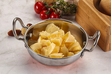 Crushed parmesan cheese in the bowl