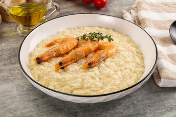 Italian risotto with prawn served thyme
