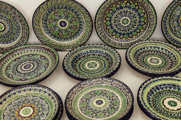 Traditional ceramics of Central Asia. Ancient traditional Uzbek ceramic dishes with national...