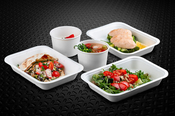 A variety of healthy and delicious meal options packed in eco-friendly containers for a convenient and sustainable way to eat.