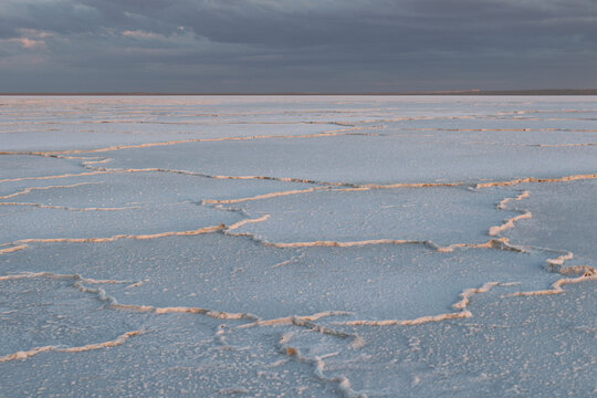 Small edge in the Tuzbair lake in Kazahstan. Dark sky and white flat.