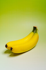 Close-up shot of yellow banana against green background