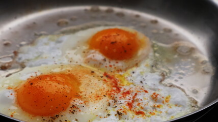 fried eggs in a pan