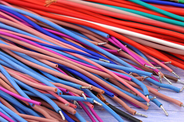 Copper electrical wiring wires in colored insulation for connecting electrical equipment. Close-up....