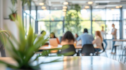 Group of people collaborating together in a modern office, defocused background