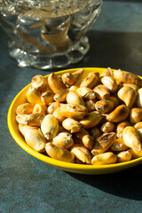 Macro photograph of Peruvian roasted corn on a plate. Natural food concept.