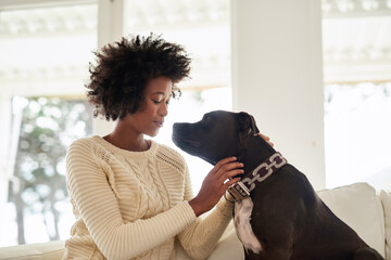 Home, relax and black woman with dog, care and animal with happiness, bonding together and calm....