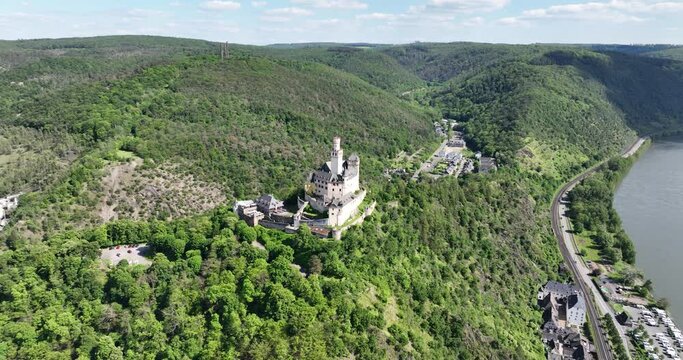 Aerial drone view on the Marksburg castle in Braubach under Koblenz in Germany along the rhine river.