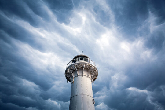 Lighthouse head shrouded my dark moody mammatus clouds