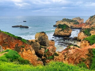 Portimao, Alvor coast, Portugal, Algarve. Rocks, rocky shore, yellow rocks, coquina, beautiful coastline