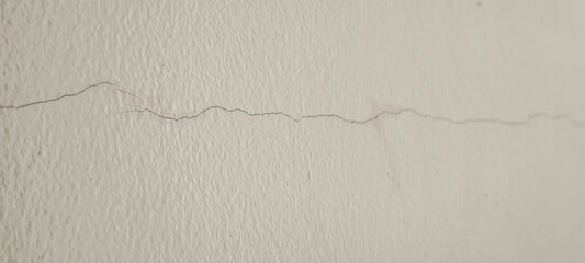 Small cracks on the white wall
